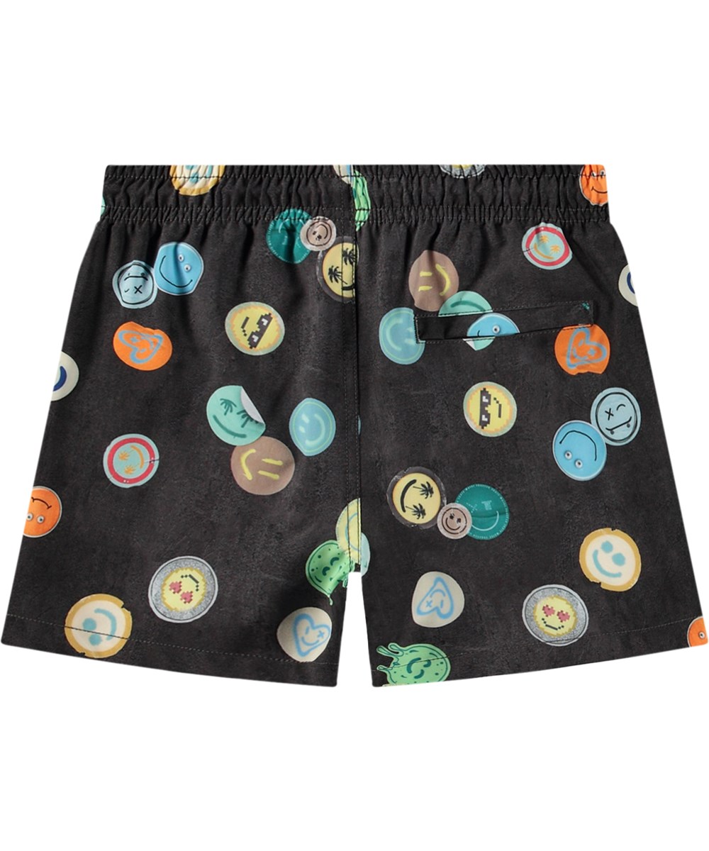 Niko - Smile All Over - Black sporty swim shorts for active children in recycled polyester with UV protection 50+.