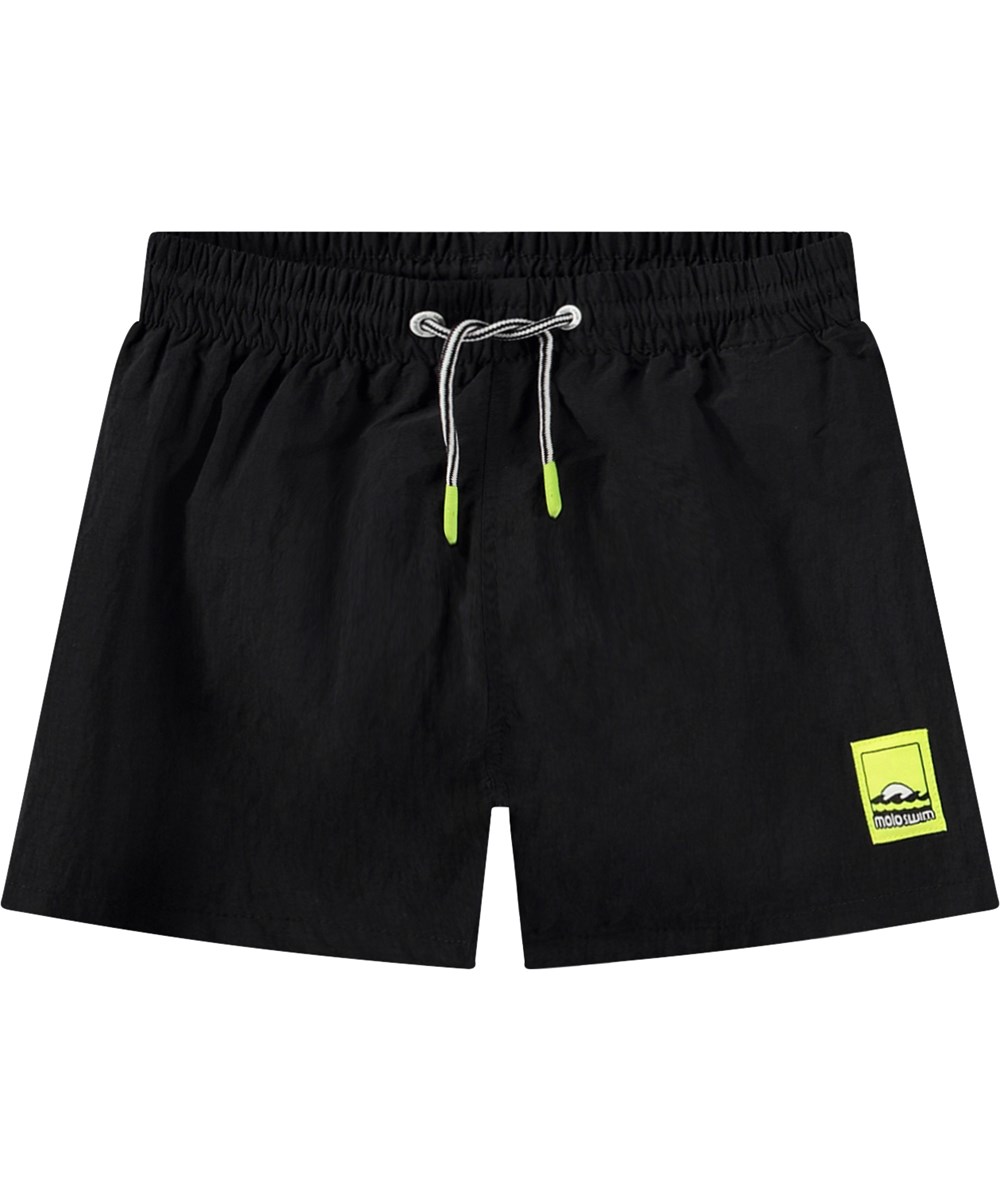 Niko Solid - Black - Sporty black swim shorts for active children in recycled nylon with UV protection 50+.
