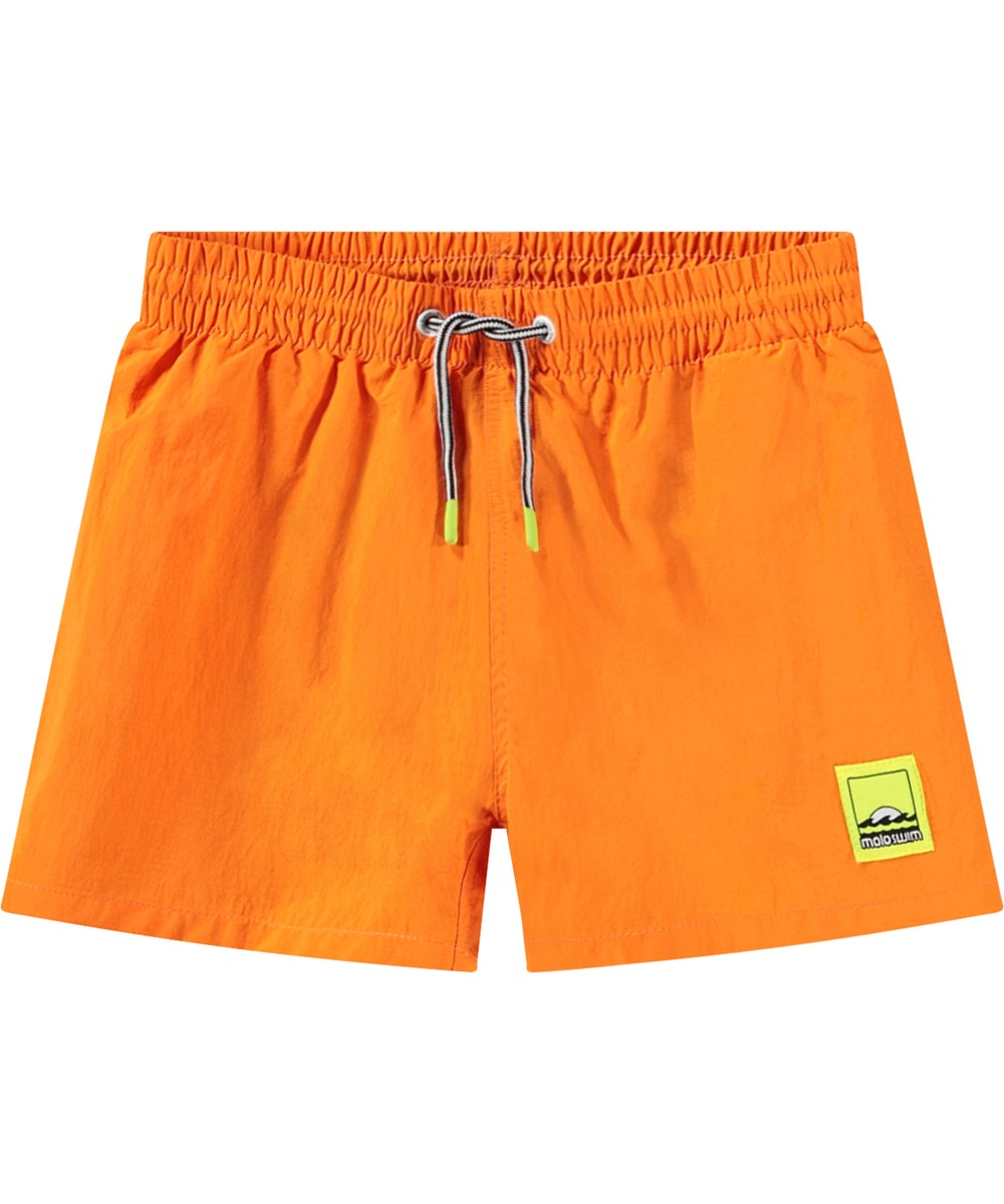 Niko Solid - Tumeric - Sporty orange swim shorts for active children in recycled nylon with UV protection 50+.