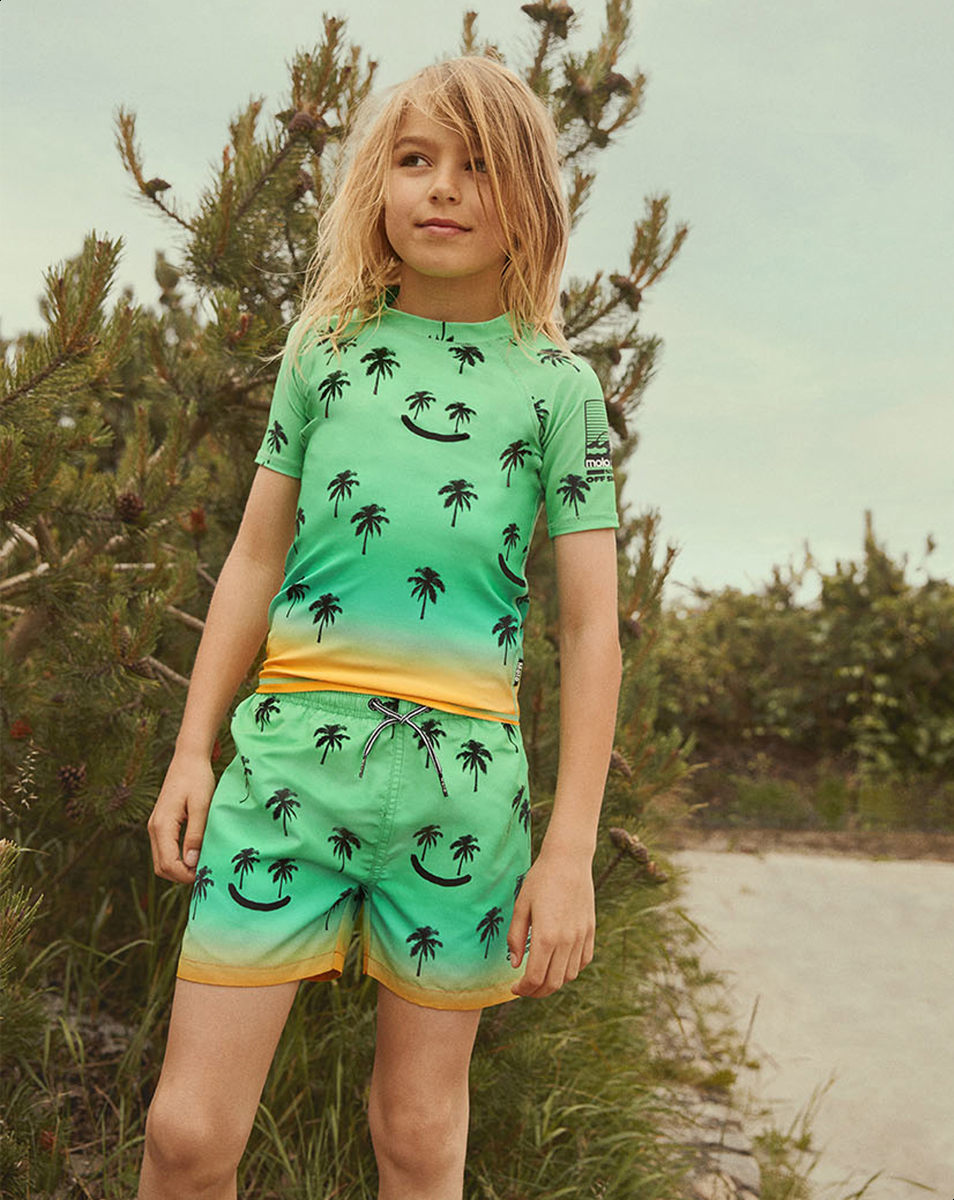 Niko Summer Happy Green swim shorts with orange background and palm