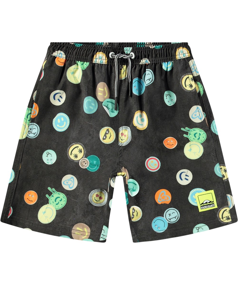 Nilson - Smile All Over - Knee-length black swim shorts for active children in recycled polyester with UV protection 50+.