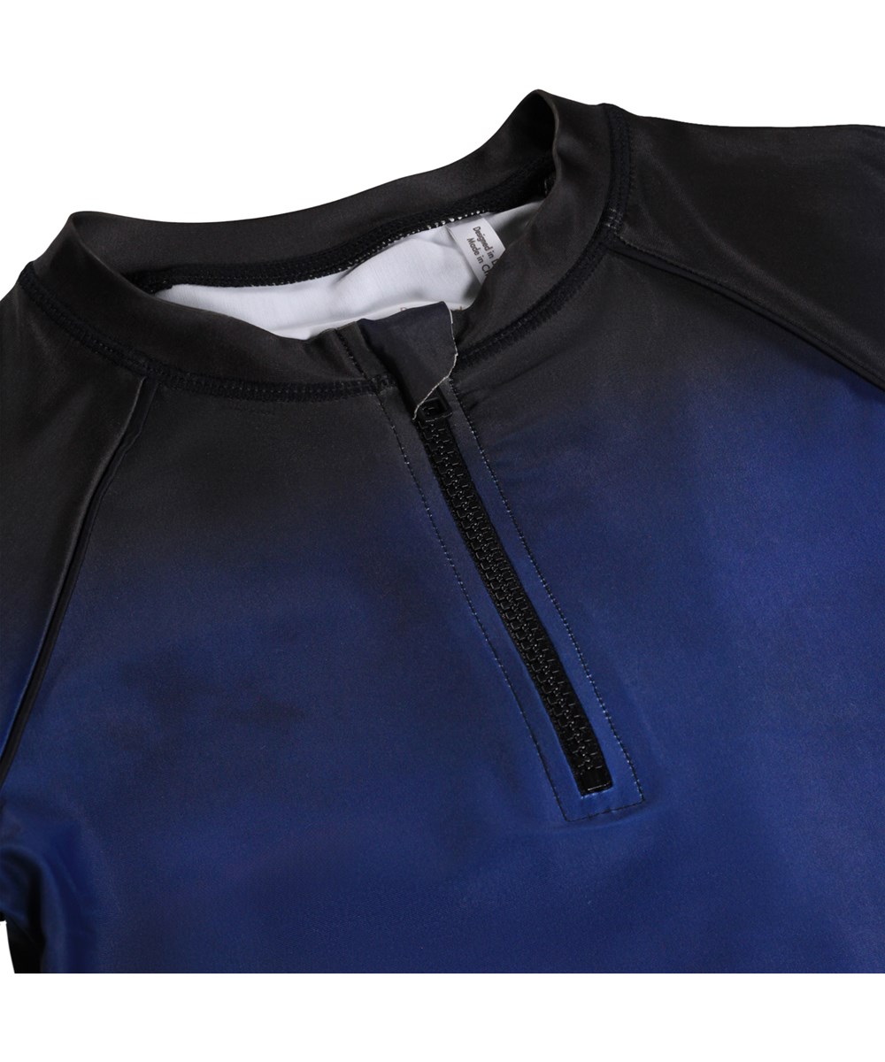 Noble - Big Ocean - Blue swim shirt with sea print and zip for children made from recycled polyester with UV protection 50+.