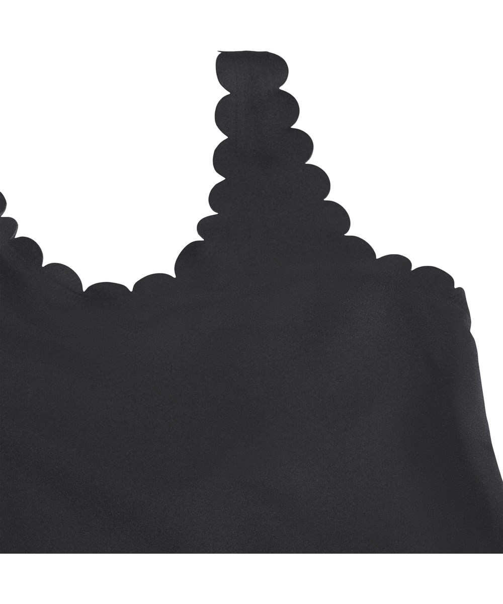 Noelle - Black - Black swimsuit with wave edges for children made from recycled polyester with UV protection 50+.