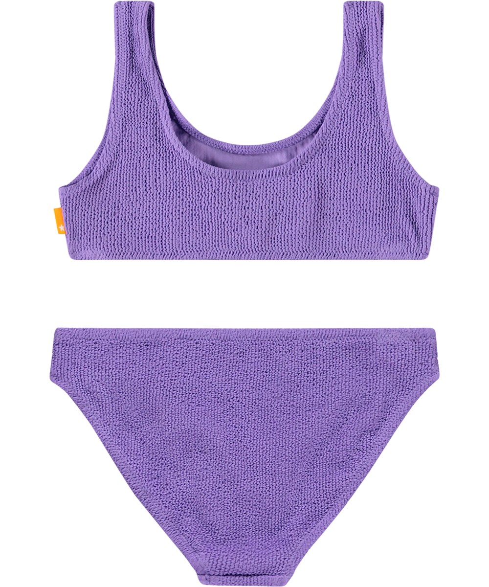Nola Solid - Purple Glo - Stretchable purple bikini for children in a textured pattern with UV protection 50+.