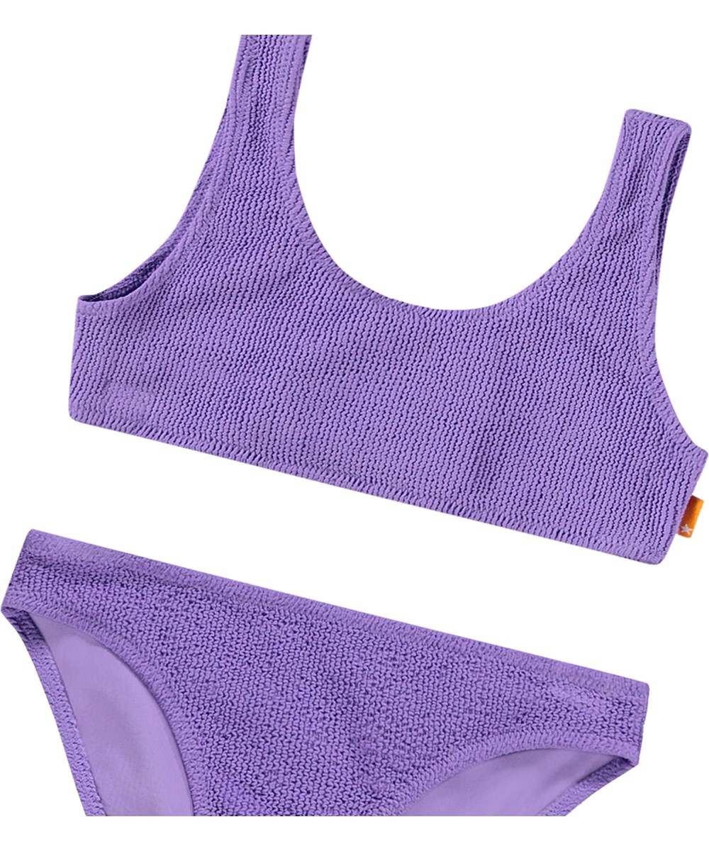 Nola Solid - Purple Glo - Stretchable purple bikini for children in a textured pattern with UV protection 50+.