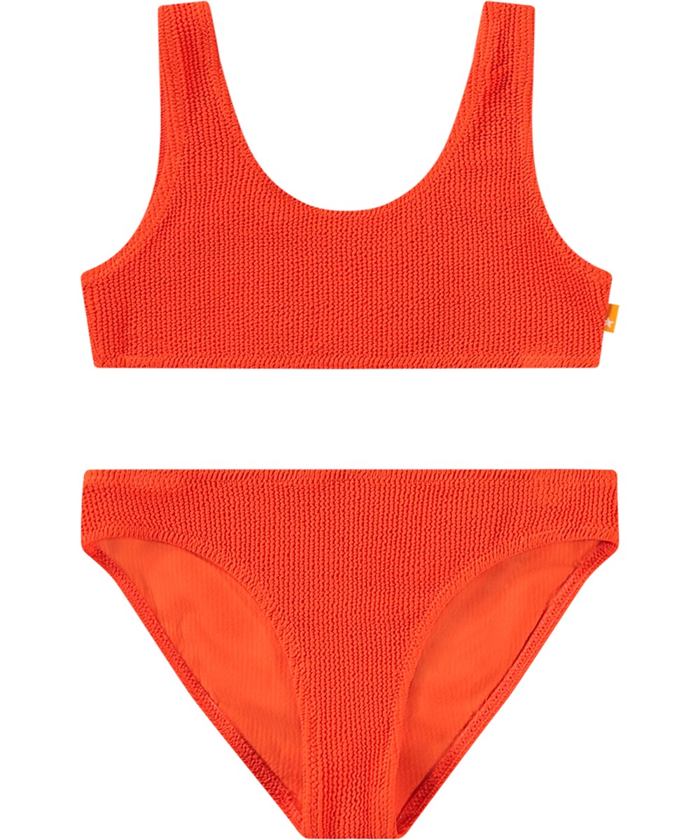 Nola Solid - Strawberry Hot - Stretchable red bikini for children in textured pattern with UV protection 50+.