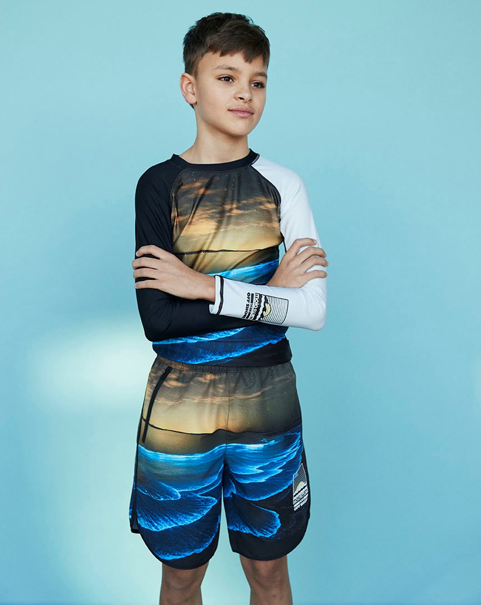 Nox - Glowing Ocean - Swim shorts with ocean print and sunset