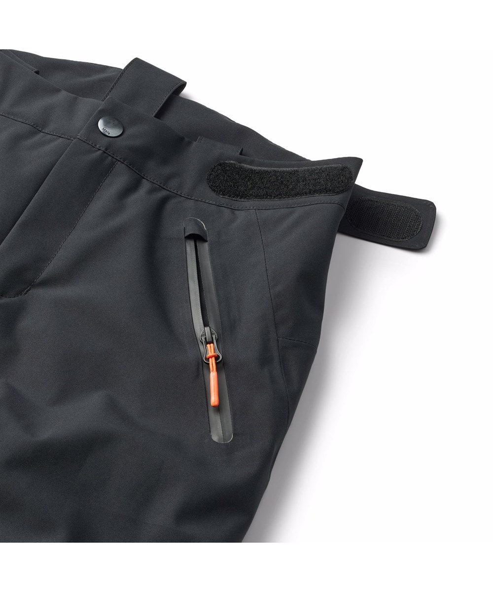 Jump Pro - Black - Svarta vind- och vattentäta skidbyxor för barn tillverkade av återvunnen polyester och vadderade med 3M™ Thinsulate™.