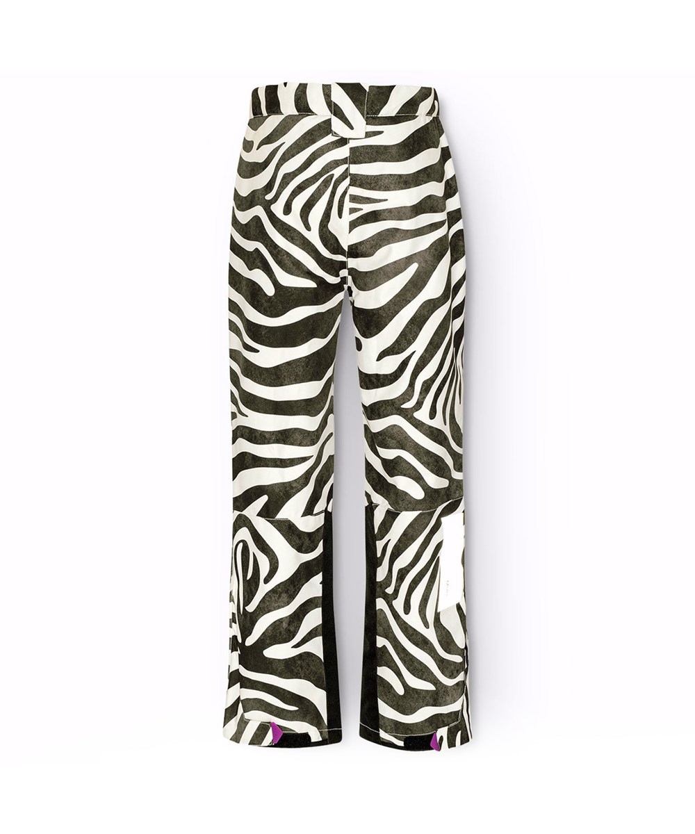 Jump Pro - Zebra - Vind- och vattentäta byxor för barn i återvunnen polyester med svart och vitt zebramönster.