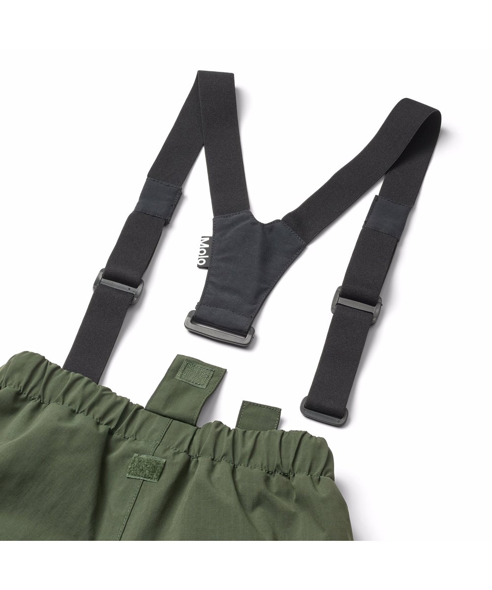 Paxton - Dark Forest - Mörkgröna vind- och vattentäta byxor för barn tillverkade av återvunnen nylon med justerbar midja.