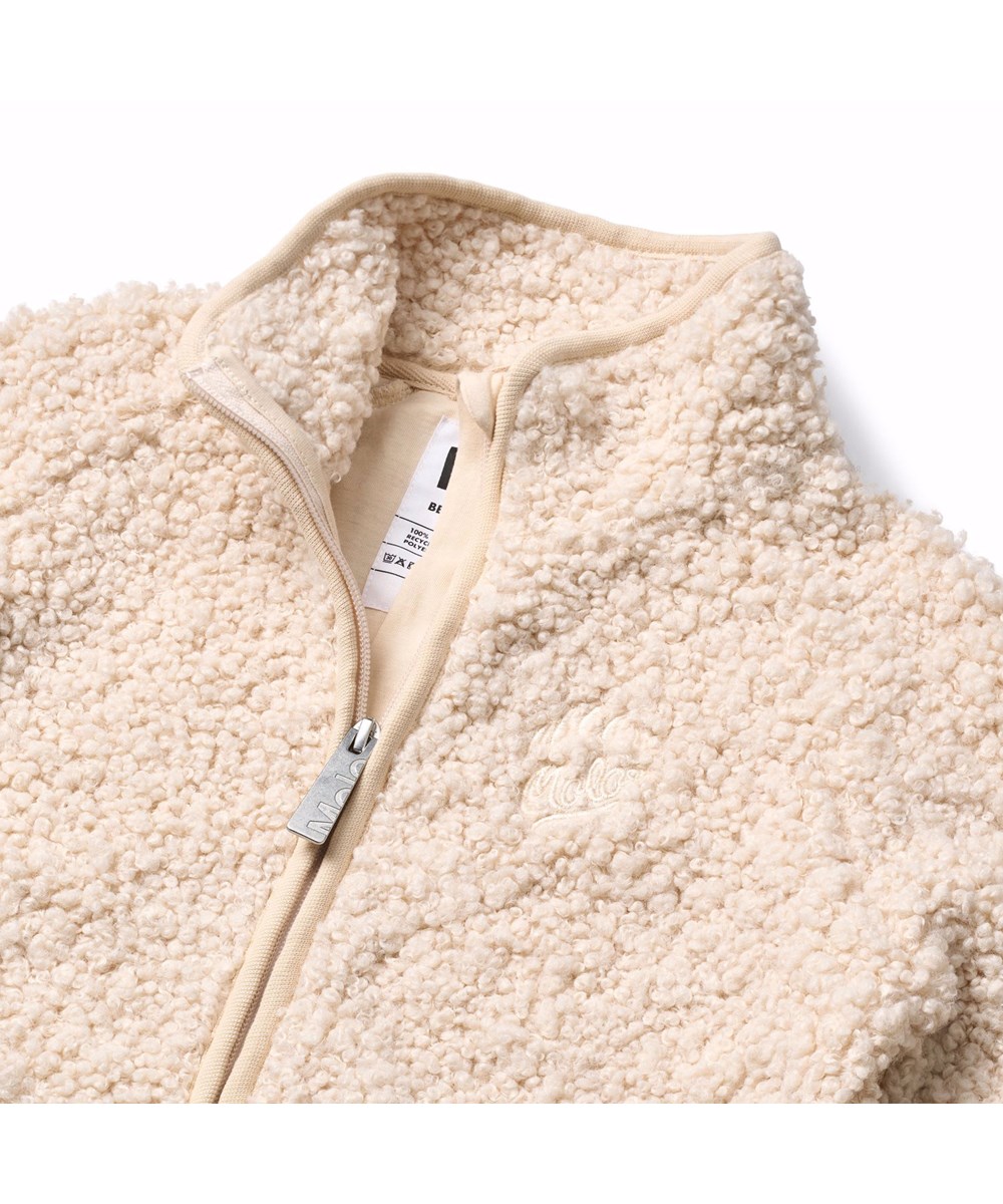 Ulan - Vanilla - Off-white fleecejacka för barn tillverkad av återvunnen polyester med en fin ryggdetalj i hållbar nylon.