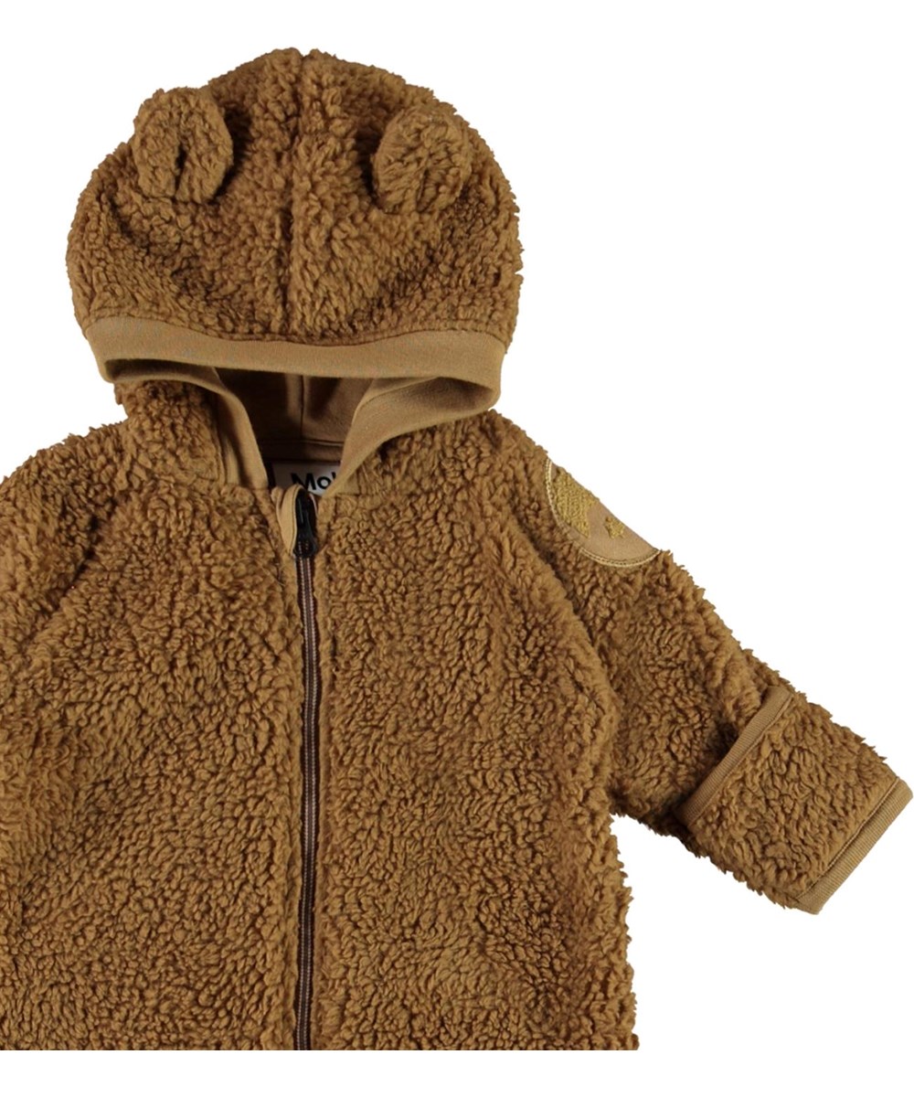 Umeko - Sandstone - Brunfleecedräkt med öron till baby.