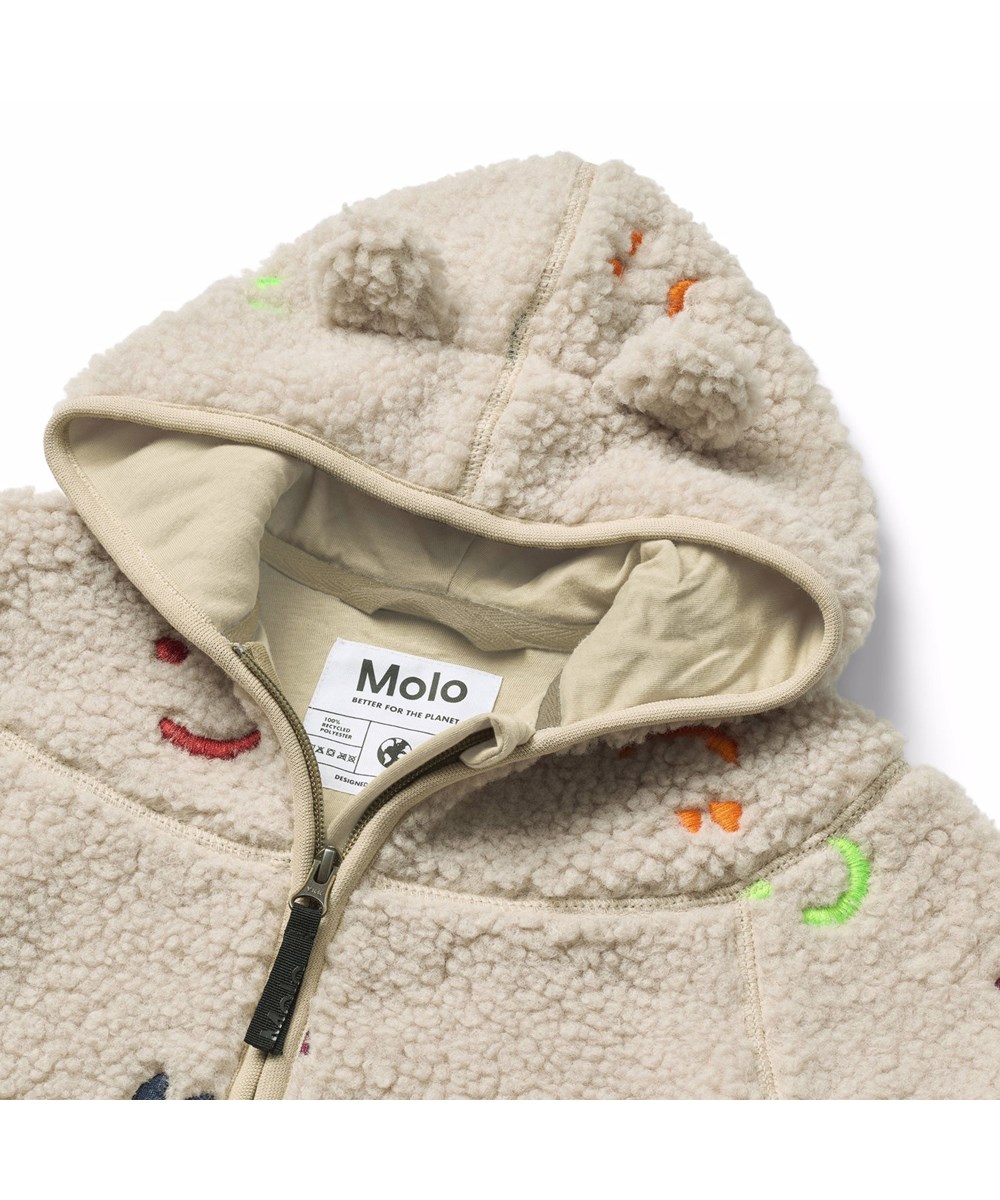 Ummi - Teddy Emotions - Beige fleecefodrad jacka för de små i återvunnen polyester med färgglada broderade smileys.
