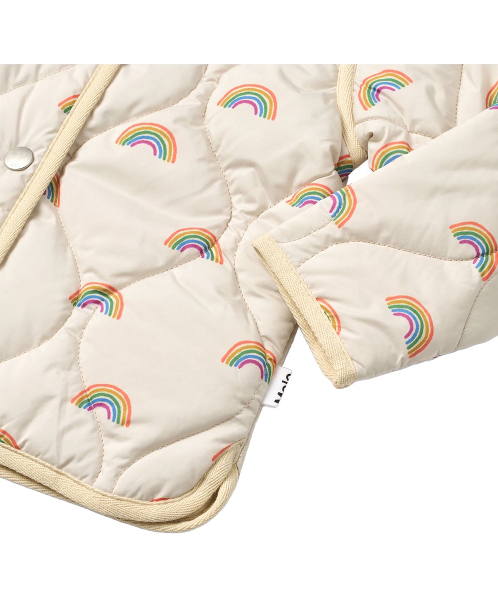 Harrie - Small Rainbows - Beige vattenavvisande termojacka av återvunnen nylon med regnbågsprint för barn