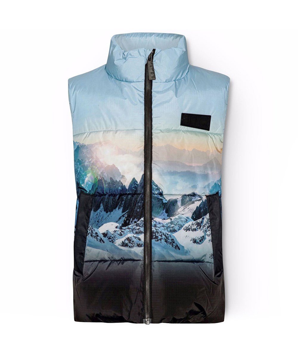 Heike - High In Sky - Varm väst för barn i återvunnen polyester med ett tryck av snöklädda alper, solstrålar och en klar himmel.