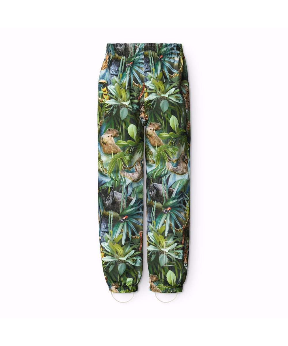 Waits - Jungle Life - Gröna vind- och vattentäta regnbyxor för barn i återvunnen polyester.