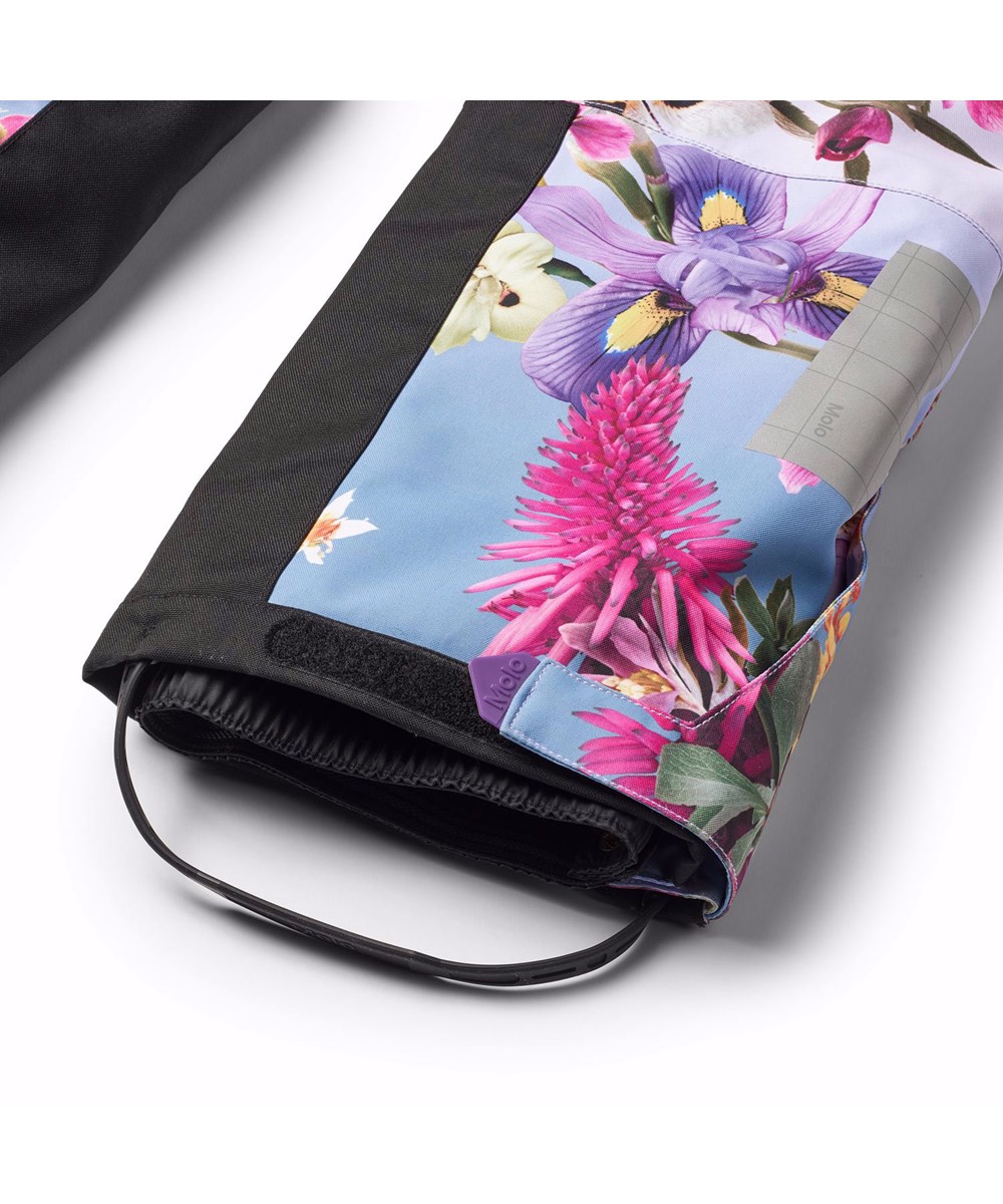 Hux - Gradient Bloom - Blå och lila barnoverall tillverkad av återvunnen polyester med blommigt mönster.