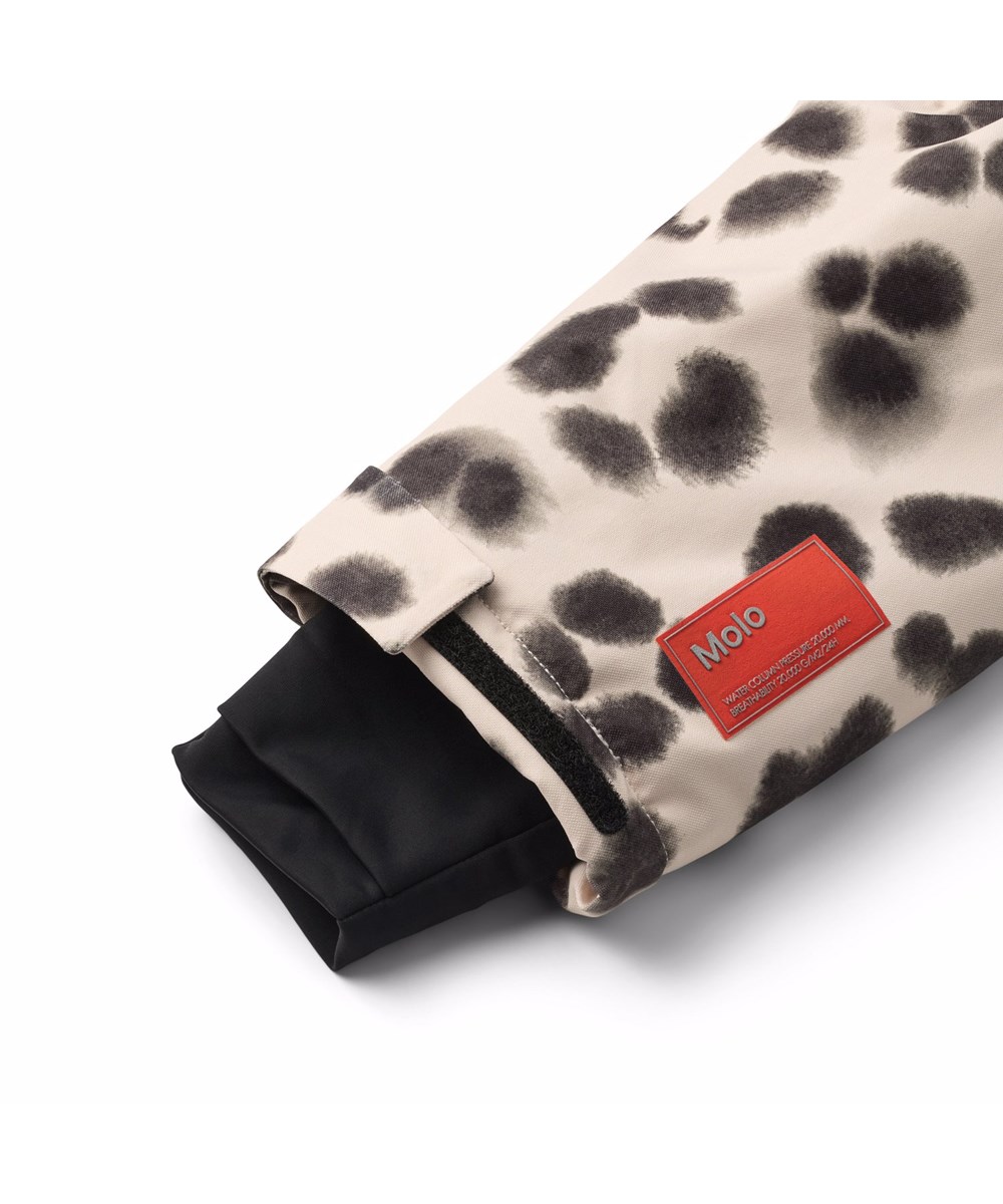 Hux - Snow Leo - Vind- och vattentät overall i ett unikt leopardmönster för en kall vinter eller skidsemester i återvunnen polyester och vadderad med 3M™ Thinsulate™.