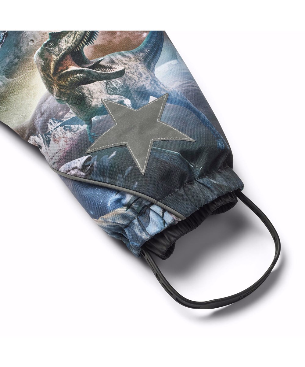 Pyxis - Dino In Space - Blå barnoverall i återvunnen polyester med ett tryck av dinosaurier i rymden.